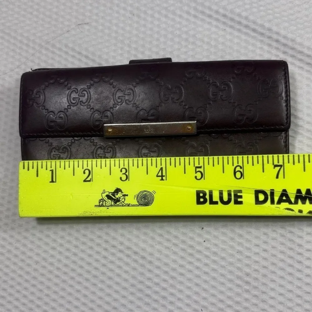 Gucci Dark Brown Embossed Clutch wallet inside is clean. GUC much life left!